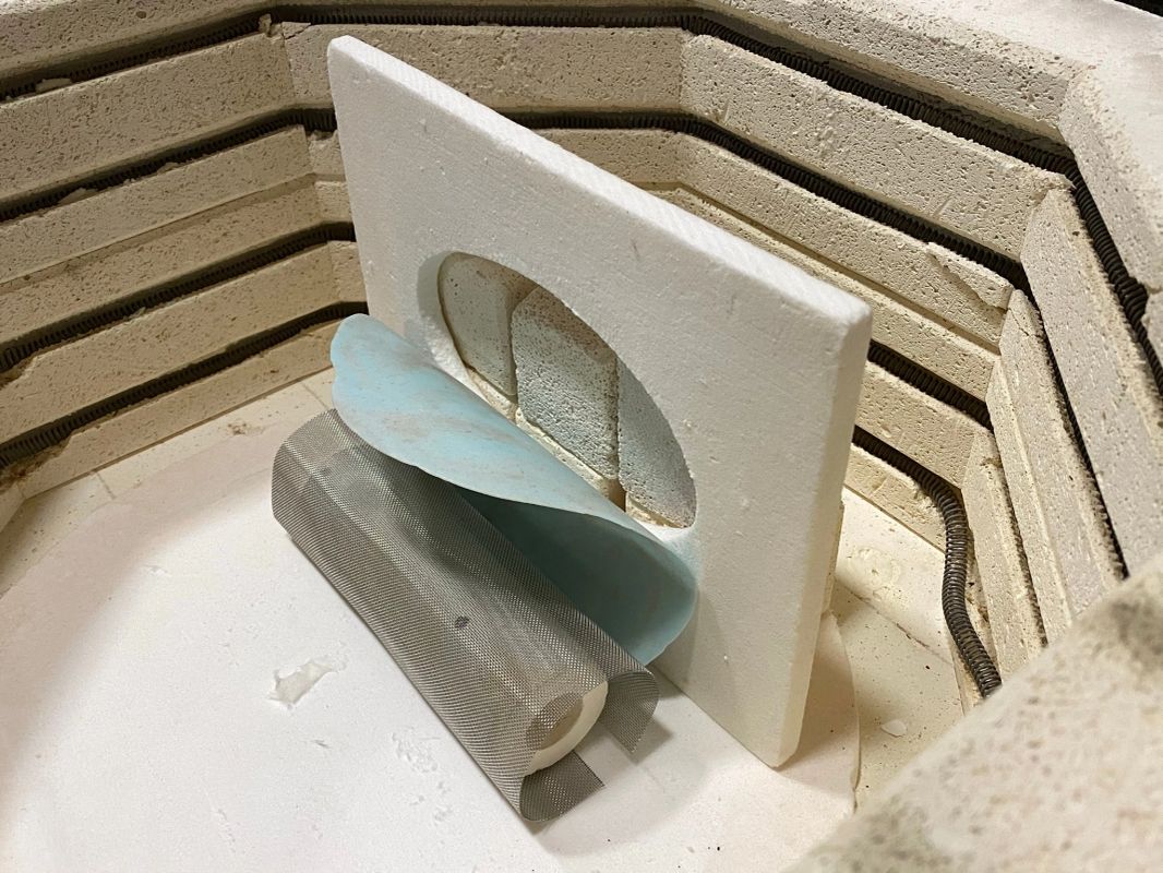 Miracle Mesh and glass arranged inside a kiln